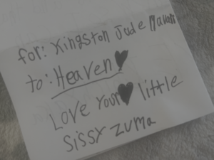 Front of a folded note from 9-year-old Zuma, addressed to her brother Kingston in heaven, written at home before Maile knew what was inside.